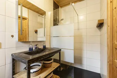 a bathroom with a sink and a mirror at Epicea - Cosy 1CH 35m2 Centre Parking Calme WIFI in Chamonix-Mont-Blanc