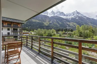 a balcony with a view of the mountains at Cordee - Appart 2CH Balcon SUD Vues Residence Premium in Chamonix-Mont-Blanc