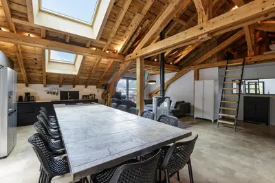 a large conference room with a large table and chairs at Flocon - Loft Moderne 8pax Sauna Poele Vues Garage in Chamonix-Mont-Blanc