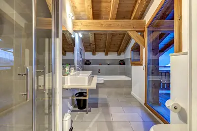 a bathroom with a shower and a sink at Chosalets - Chalet 200m2 Cheminee Jacuzzi Sauna Vues in Chamonix-Mont-Blanc