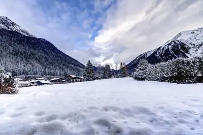 a snow covered mountain with footprints in the snow at Chosalets - Chalet 200m2 Cheminee Jacuzzi Sauna Vues in Chamonix-Mont-Blanc
