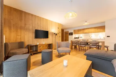 a living room with a couch and a table at Chatelet Appart 3CH Proche remontees Centrale Vues in Saint-Gervais-les-Bains