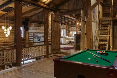 a billiard room with a pool table in a cabin at Lavancher - Chalet 400m2 Ferme 1803 renovee Sauna Billard in Chamonix-Mont-Blanc