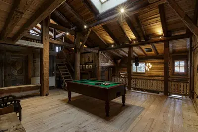 a pool table in a room with wooden ceilings at Lavancher - Chalet 400m2 Ferme 1803 renovee Sauna Billard in Chamonix-Mont-Blanc