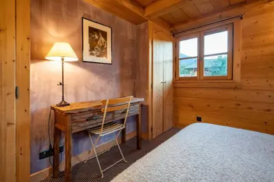 a home office with a desk and a lamp at Ibex - Chalet 170m2 Cheminee Vue Confort Calme in Les Houches