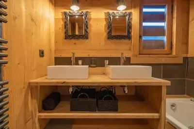 a bathroom with two sinks on a wooden counter at Ibex - Chalet 170m2 Cheminee Vue Confort Calme in Les Houches