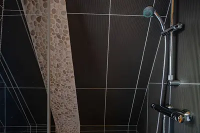 a shower with a shower head in a bathroom at Astoria - UltraCentral 140m2 Balcons Vues Balneo Sauna in Chamonix-Mont-Blanc