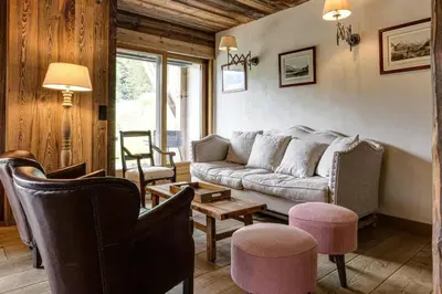 a living room with a couch and two chairs at Gublin - Apart Famille Vue360 Nature Calme Cheminee in Les Houches