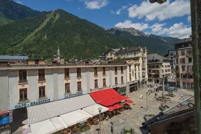 a group of buildings in a town with a mountain at Balmat - UltraCentral 2pax Confort Vue Quartier Vivant in Chamonix-Mont-Blanc
