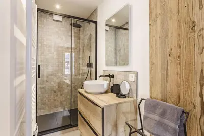 a bathroom with a sink and a shower at Balmat - UltraCentral 2pax Confort Vue Quartier Vivant in Chamonix-Mont-Blanc