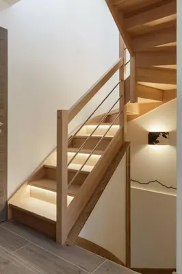 a staircase in a house with wooden steps at Levant Chalet Moderne 6pax Vues Terrasses Confort in Chamonix-Mont-Blanc