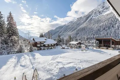 a view of a resort in the snow at Argentero Cosy Duplex Pied Pistes Vue Grands Montets in Chamonix-Mont-Blanc