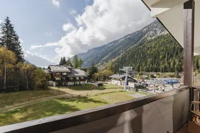 a view of a mountain from a balcony at Argentero Cosy Duplex Pied Pistes Vue Grands Montets in Chamonix-Mont-Blanc
