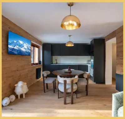 a kitchen and dining room with a table and chairs at Le Balcon du Mont-BIanc I Duplex I Combloux in Combloux