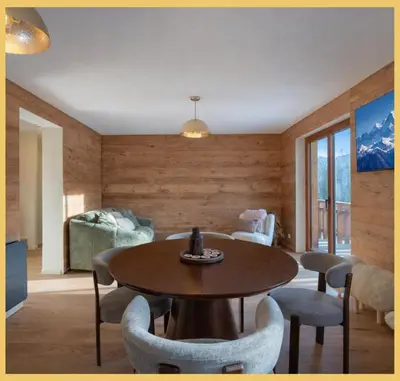 a living room with a table and chairs at Le Balcon du Mont-BIanc I Duplex I Combloux in Combloux
