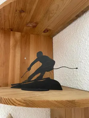 a statue of a man on a shelf at Cocon Saint-Gervais in Saint-Gervais-les-Bains