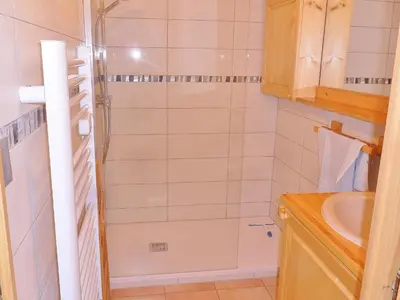a small bathroom with a shower and a sink at Duplex à Samoëns, 6 pers, balcon sud, parking - FR-1-815-48 in Samoëns