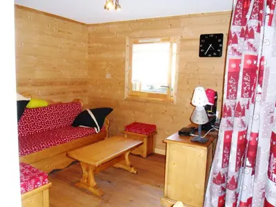 a living room with a couch and a table at Appartement neuf 3 pièces - 6 pers - Vue montagne - FR-1-815-49 in Samoëns