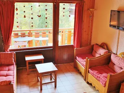 a living room with two couches and a window at Charmant appartement à Samoëns pour 8 pers avec balcon - FR-1-815-112 in Samoëns
