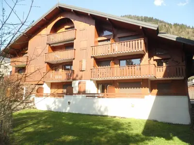 a building with balconies on the side of it at Charmant appartement à Samoëns pour 8 pers avec balcon - FR-1-815-112 in Samoëns