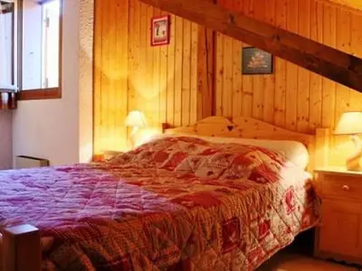 a bedroom with a large bed in a room at Charmant appartement à Samoëns pour 8 pers avec balcon - FR-1-815-112 in Samoëns