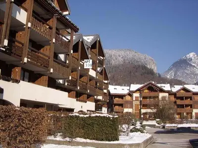 a large apartment building with snow on it at Studio cosy avec balcon à Samoëns, parking inclus, pour 4 pers. - FR-1-815-114 in Samoëns