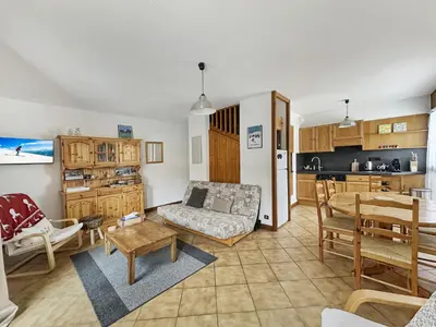 a living room with a couch and a table at ES117 - Duplex 6 pers pied de pistes in Les Carroz d'Araches