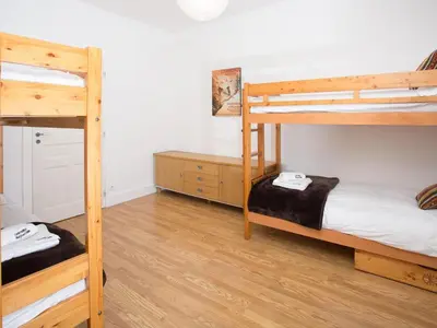 a room with two bunk beds and a desk at Apartment Wohnung in Chamonix by Interhome in Chamonix-Mont-Blanc