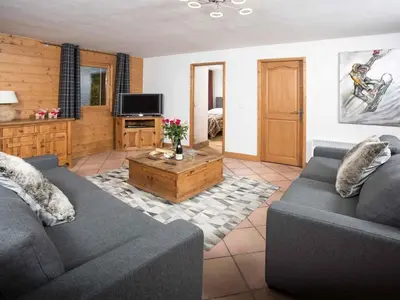 a living room with two couches and a coffee table at Apartment Ginabelle 8 Wohnung by Interhome in Chamonix-Mont-Blanc
