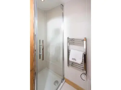 a shower with a glass door in a bathroom at Apartment Ginabelle 8 Wohnung by Interhome in Chamonix-Mont-Blanc