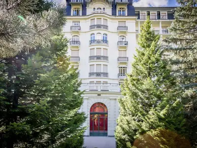 a large white building with trees in front of it at Apartment in Chamonix und Bergblick by Interhome in Chamonix-Mont-Blanc
