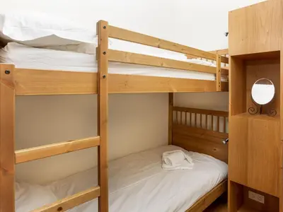 a couple of bunk beds in a room at Apartment in Chamonix und Bergblick by Interhome in Chamonix-Mont-Blanc