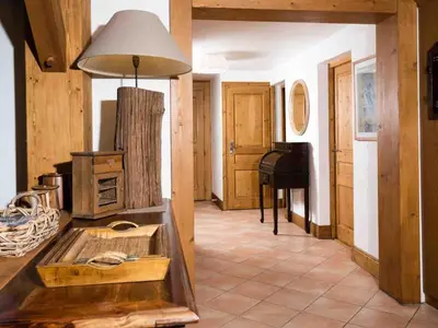 a kitchen with a stove and a piano in a room at Apartment Komfortable Wohnung in Chamonix mit Südterrasse by Interhome in Chamonix-Mont-Blanc