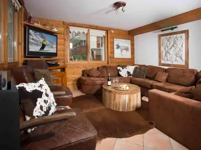 a living room with a couch and a coffee table at Apartment Komfortable Wohnung in Chamonix mit Südterrasse by Interhome in Chamonix-Mont-Blanc