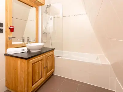 a bathroom with a sink and a shower at Apartment in Chamonix Centre-Ville by Interhome in Chamonix-Mont-Blanc