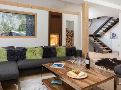 a living room with a couch and a table at Holiday Home Chalet Montana by Interhome in Chamonix-Mont-Blanc