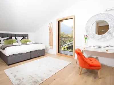 a bedroom with a bed and a desk and a chair at Holiday Home Chalet Montana by Interhome in Chamonix-Mont-Blanc