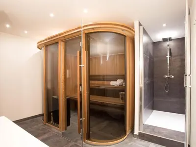 a shower with a glass door in a bathroom at Holiday Home Chalet Montana by Interhome in Chamonix-Mont-Blanc