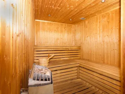 a wooden sauna with a bench in the middle at Apartment in Chamonix mit geräumigem Balkon und weitem Blick by Interhome in Chamonix-Mont-Blanc