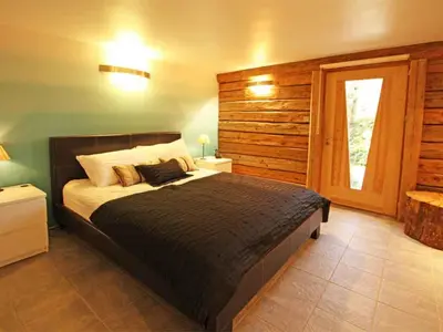 a bedroom with a large bed and a window at Holiday Home für 10 Personen in Chaonix-Mont-Blanc- Französische Alpen - Savoyer Alpen by Interhome in Chamonix-Mont-Blanc