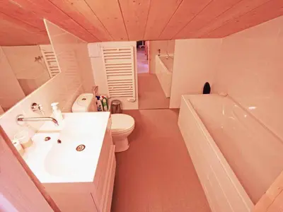 a bathroom with a sink and a toilet and a tub at Holiday Home für 10 Personen in Chaonix-Mont-Blanc- Französische Alpen - Savoyer Alpen by Interhome in Chamonix-Mont-Blanc