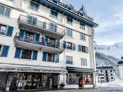 a large white building with a store in front of it at Apartment Balmat Wohnung by Interhome in Chamonix-Mont-Blanc