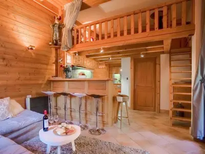a living room with a couch and a table at Apartment Lou Lou Apartment by Interhome in Chamonix-Mont-Blanc