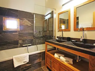 a bathroom with two sinks and a shower at Holiday Home Hütte Raphael by Interhome in Chamonix-Mont-Blanc