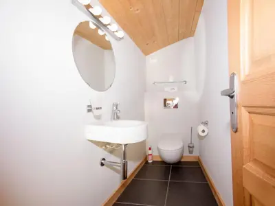 a bathroom with a sink and a toilet at Apartment Wohnung Sauberands 18 mit Balkon by Interhome in Chamonix-Mont-Blanc