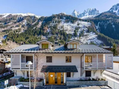a house with a mountain in the background at Apartment Wohnung Sauberands 18 mit Balkon by Interhome in Chamonix-Mont-Blanc