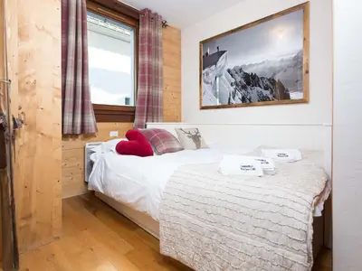 a bedroom with a bed and a window at Apartment Le Paradis 8 Wohnung by Interhome in Chamonix-Mont-Blanc