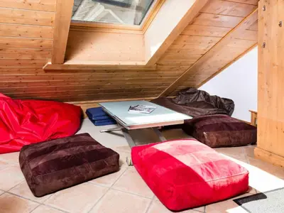 a room with a table and three bean bags at Apartment Villa Vallet Wohnung by Interhome in Chamonix-Mont-Blanc