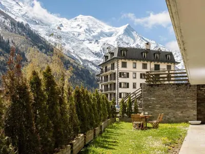 a view of a building with a mountain in the background at Apartment Apothekerwohnung by Interhome in Chamonix-Mont-Blanc