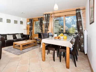 a living room with a white table and chairs at Apartment Die Sonnailles apartment by Interhome in Chamonix-Mont-Blanc